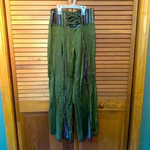 Green linen pants with multi color waist band and folds down legs, tie waist